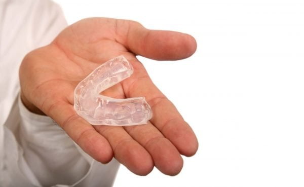 A custom mouthguard can protect teeth during impact sports.
