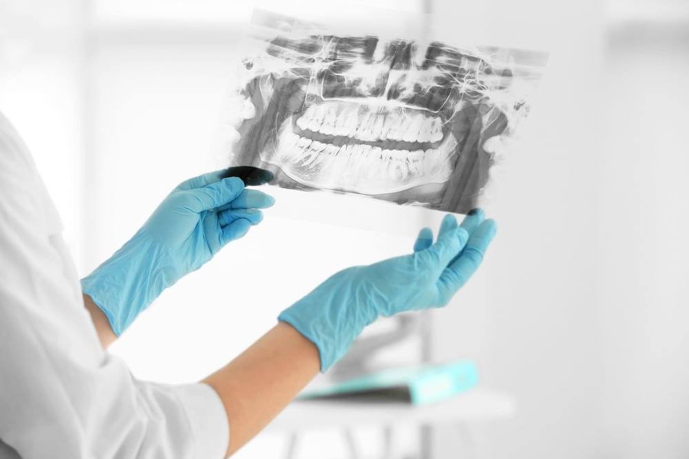 The dentist may take an X-ray to check for tooth decay or other problems.